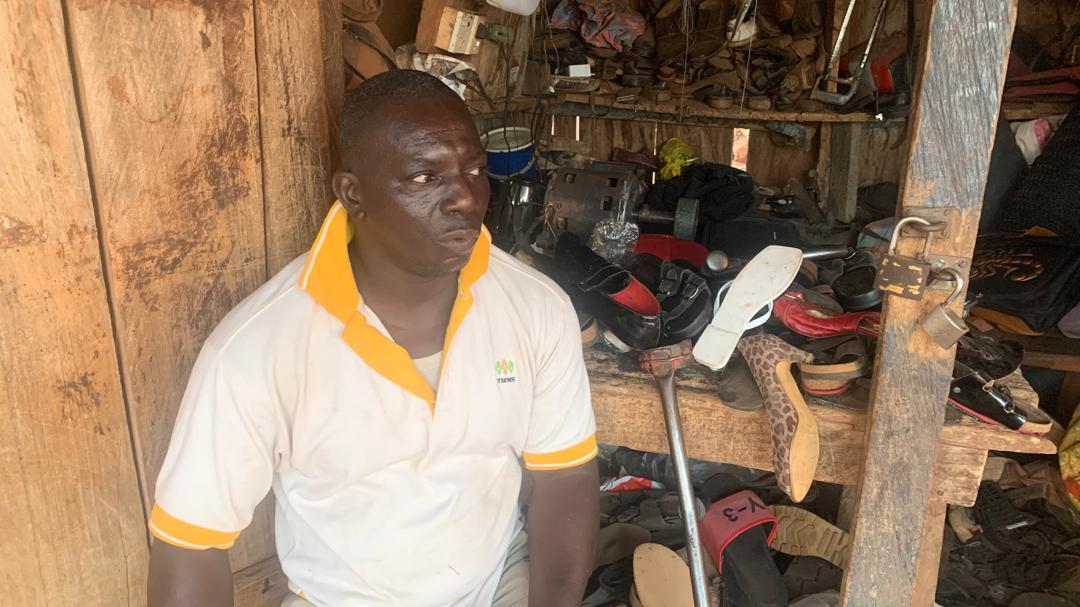Mr. Kofi, a physically challenged shoe maker